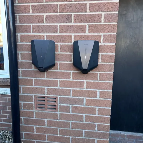 Two EV chargers side by side, the kind of two-car set-up a Hall Green electrician can install